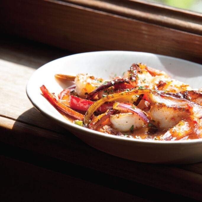 Firecracker shrimp with peppers and red onions